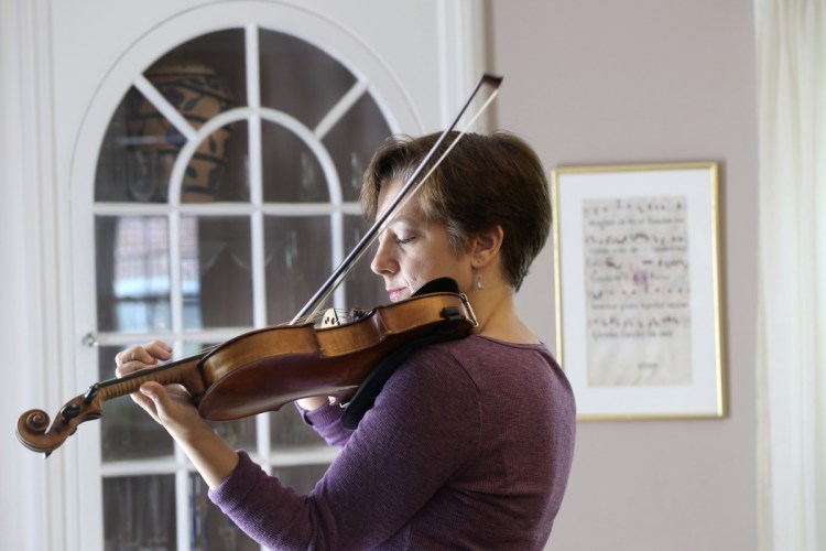 Jenny Elowitch, at home in Natick, MA, retires after this season as artistic director of the Portland Chamber Music Festival. She co-founded the festival 25 years ago.   