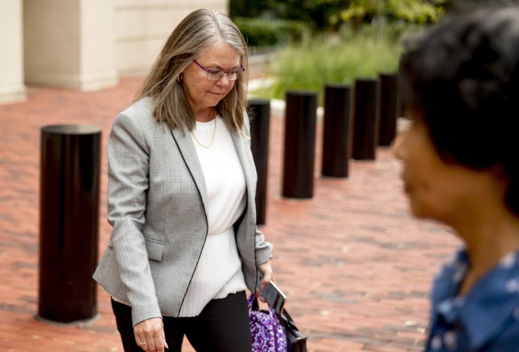 Tax preparer Cindy Laporta leaves the Alexandria Federal Courthouse in Alexandria, Va., on Friday, after testifying under immunity in the fourth day of the trial of President Trump's former campaign chairman Paul Manafort.