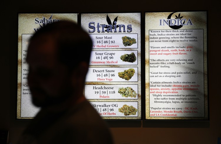 Screens display marijuana at a store in Las Vegas. Nevada regulators say the state's first year of adult-use pot sales has exceeded expectations.