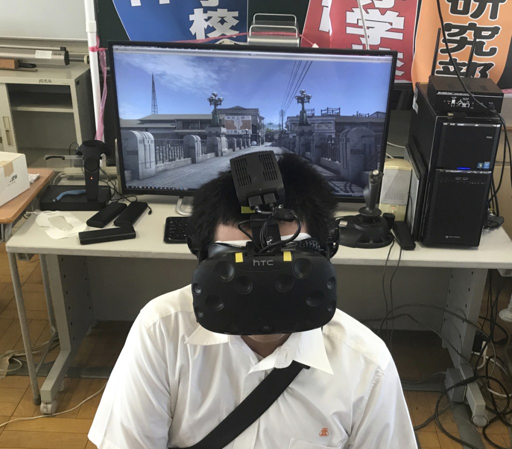 Namio Matsura of the computation skill research club views Hiroshima before the bomb fell in virtual reality.
