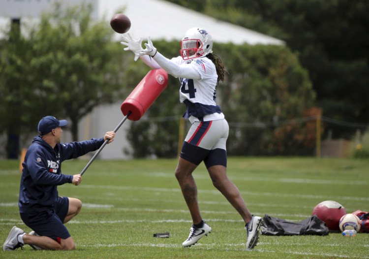 New England Patriots wide receiver Cordarrelle Patterson (84) catches a ball during an NFL football minicamp practice, Wednesday, June 6, 2018, in Foxborough, Mass. (AP Photo/Elise Amendola)