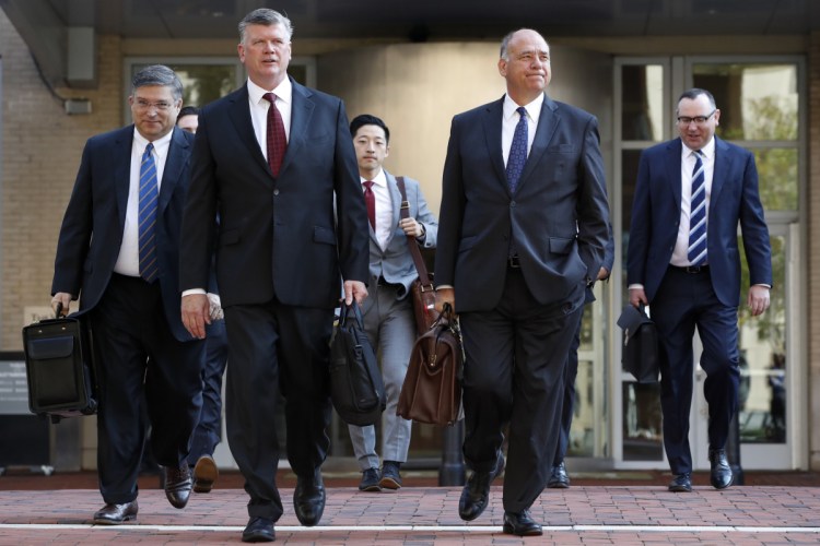 The defense team for Paul Manafort, including Kevin Downing, front left, and Thomas Zehnle, right, arrive at federal court in Alexandria, Va., on Wednesday for the continuation of the trial of the former Trump campaign chairman.