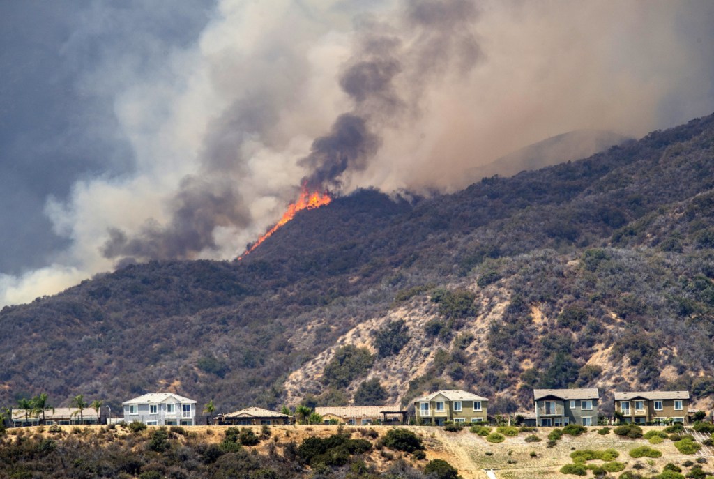 Forrest Clark, below, was charged Thursday with setting the Holy Fire near Lake Elsinore, California, on Monday.