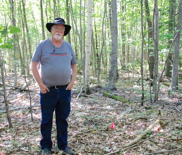 Dana Peterson, of Sanford, stands in a location in the southern part of the city where his research tells him a 1744 garrison may have been located. He and archeologists and volunteers plan to dig a series of holes this weekend and look for artifacts consistent with a garrison. The small flag in the photo shows where one of the small pits will be dug.