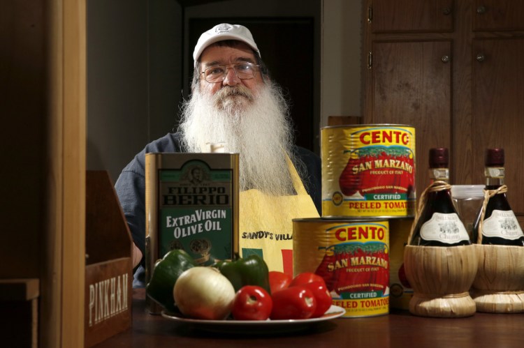 Steve DeSanctis, surrounded by some of the ingredients for Dynamite sandwiches. “This is not fast-food Italian. My sauce cooks for at least six-and-a-half hours,” says DeSanctis, whose grandfather is credited with serving the first Dynamites in Madison.