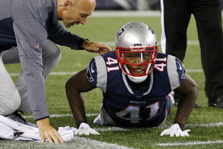 New England Patriots cornerback Cyrus Jones receives attention on the field after an injury during the first half of an NFL preseason football game against the New York Giants, Thursday, Aug. 31, 2017, in Foxborough, Mass. ()