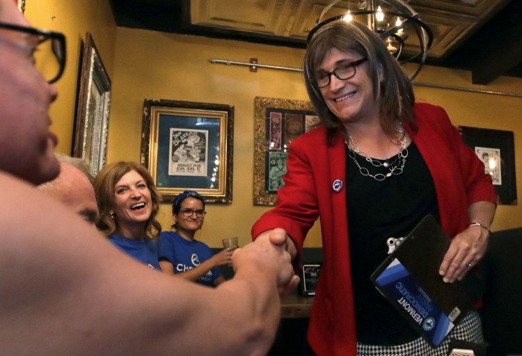 Christine Hallquist shakes hands with supporters Tuesday after becoming the first transgender candidate to win a major political party's nomination for governor.