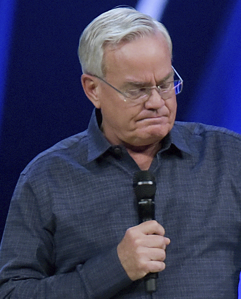 Willow Creek Community Church Senior Pastor Bill Hybels stands before his congregation April 10 in South Barrington, Ill., where he announced his early retirement.