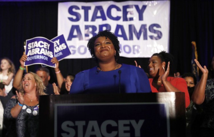 Georgia Democratic gubernatorial candidate Stacey Abrams faces her supporters on election night in Atlanta. More women than ever before have won their primaries.