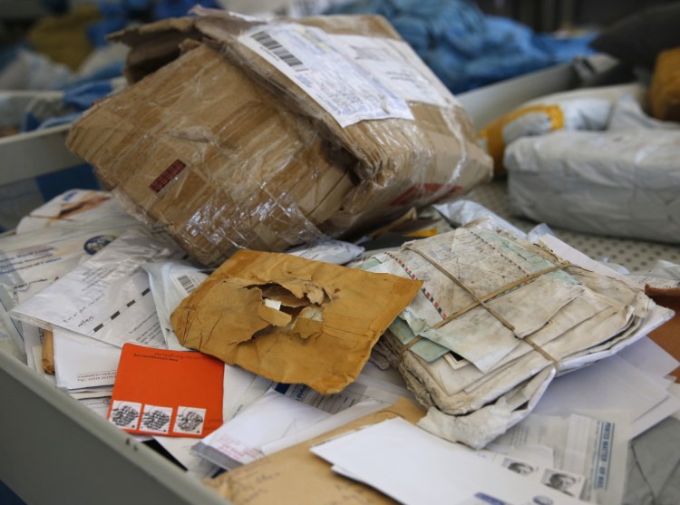 Some of the years-old mail that Palestinians are working to sort. Israeli officials say the one-time release of 10.5 tons of mail was a "gesture."