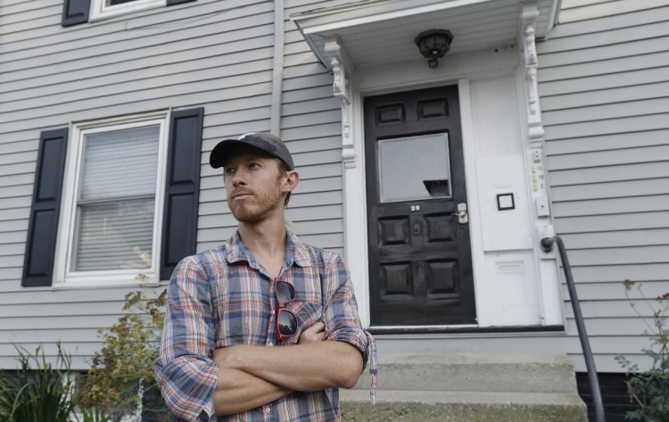 William Hessian stands Thursday outside the Frederic Street building in Portland where he used to rent an apartment before it was listed on Airbnb. The city is considering revisiting rules for short-term rentals, giving its housing crunch and skyrocketing year-round rents.