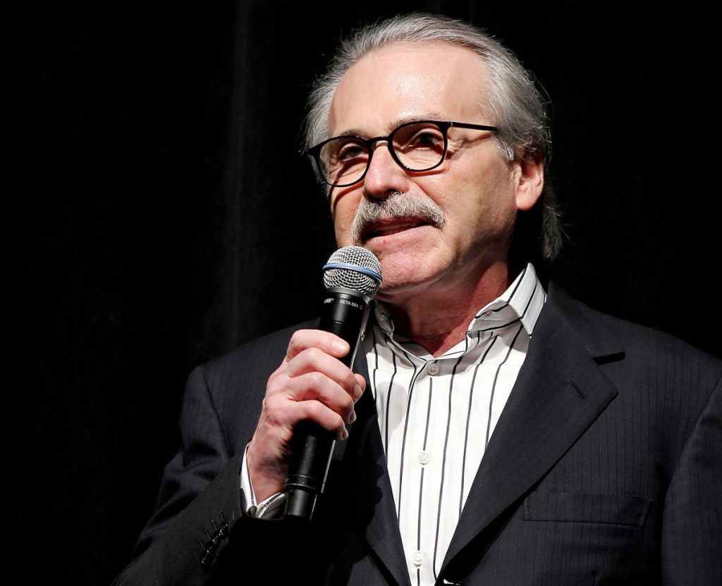 In this Jan. 31, 2014 photo, David Pecker, Chairman and CEO of American Media, addresses those attending the Shape & Men's Fitness Super Bowl Party in New York. The Aug. 21, 2018 plea deal reached by Donald Trump's former attorney Michael Cohen has laid bare a relationship between the president and Pecker, whose company publishes the National Enquirer. Besides detailing tabloid's involvement in payoffs to porn star Stormy Daniels and Playboy Playmate Karen McDougal to keep quiet about alleged affairs with Trump, court papers showed how David Pecker, a longtime friend of the president, offered to help Trump stave off negative stories during the 2016 campaign.