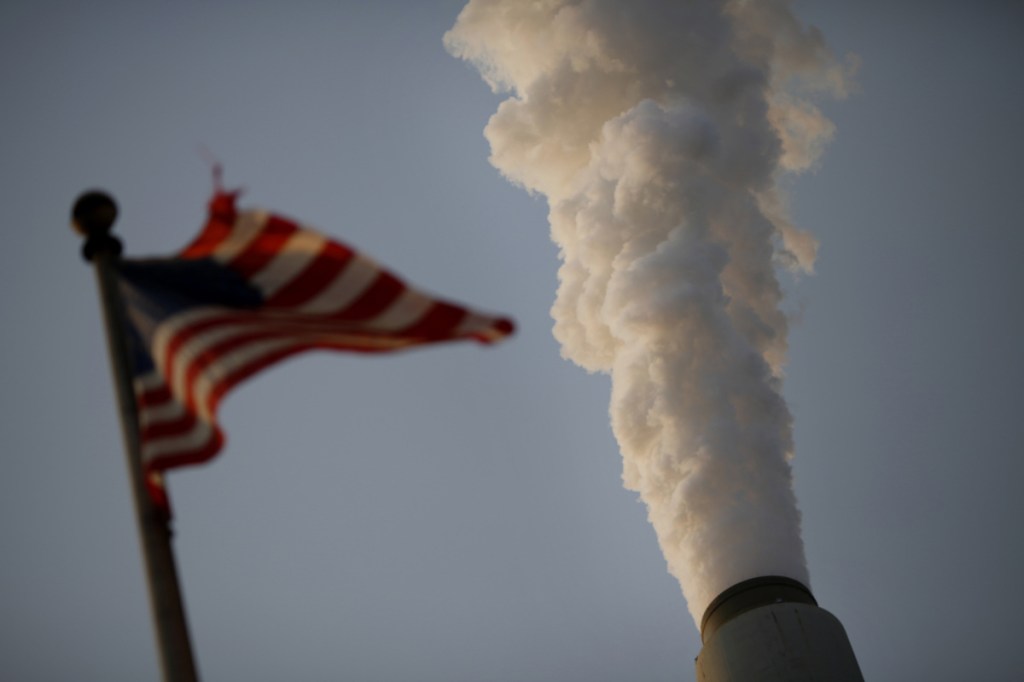 A U.S. flag flies at a coal-fired power plant in West Virginia, one of President Trump's most loyal states.