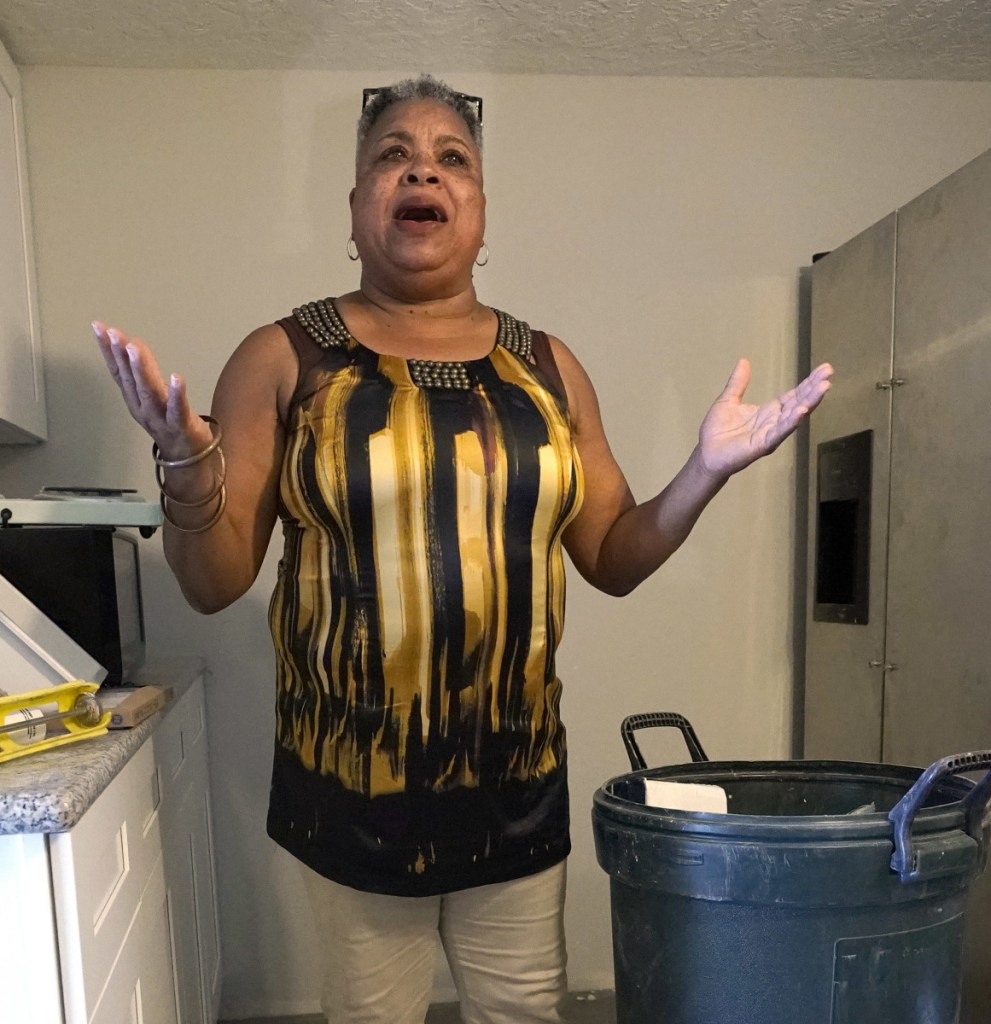 Shirley Paley talks about surviving Harvey earlier this month as she stands inside her Houston home. To the right, debris lines a road in Houston nearly a month after the hurricane passed through late last summer.