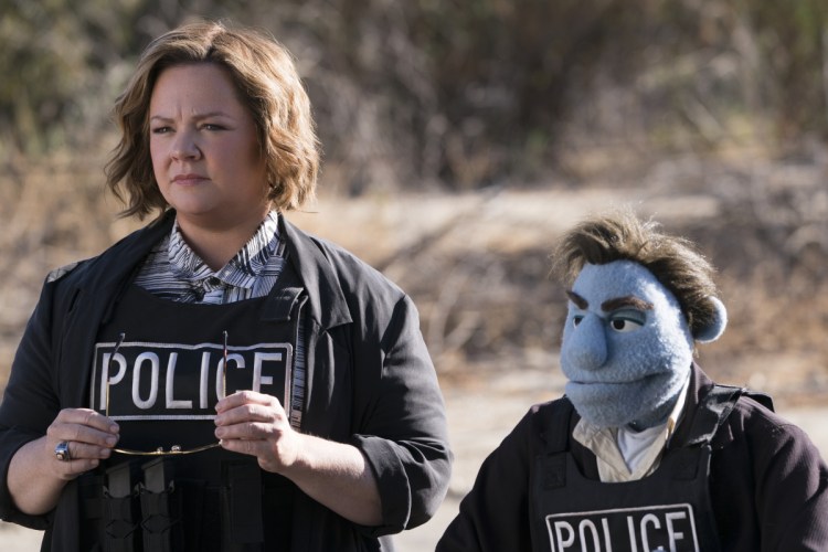 Melissa McCarthy in a scene from "The Happytime Murders." Weekend audiences shunned this puppet caper and the robot-dog fantasy "A.X.L." and mobbed "Asians."