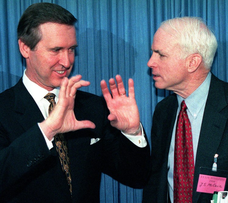 Secretary of Defense William Cohen, left, speaks to Sen. John McCain at a security conference in Munich in 1998.
