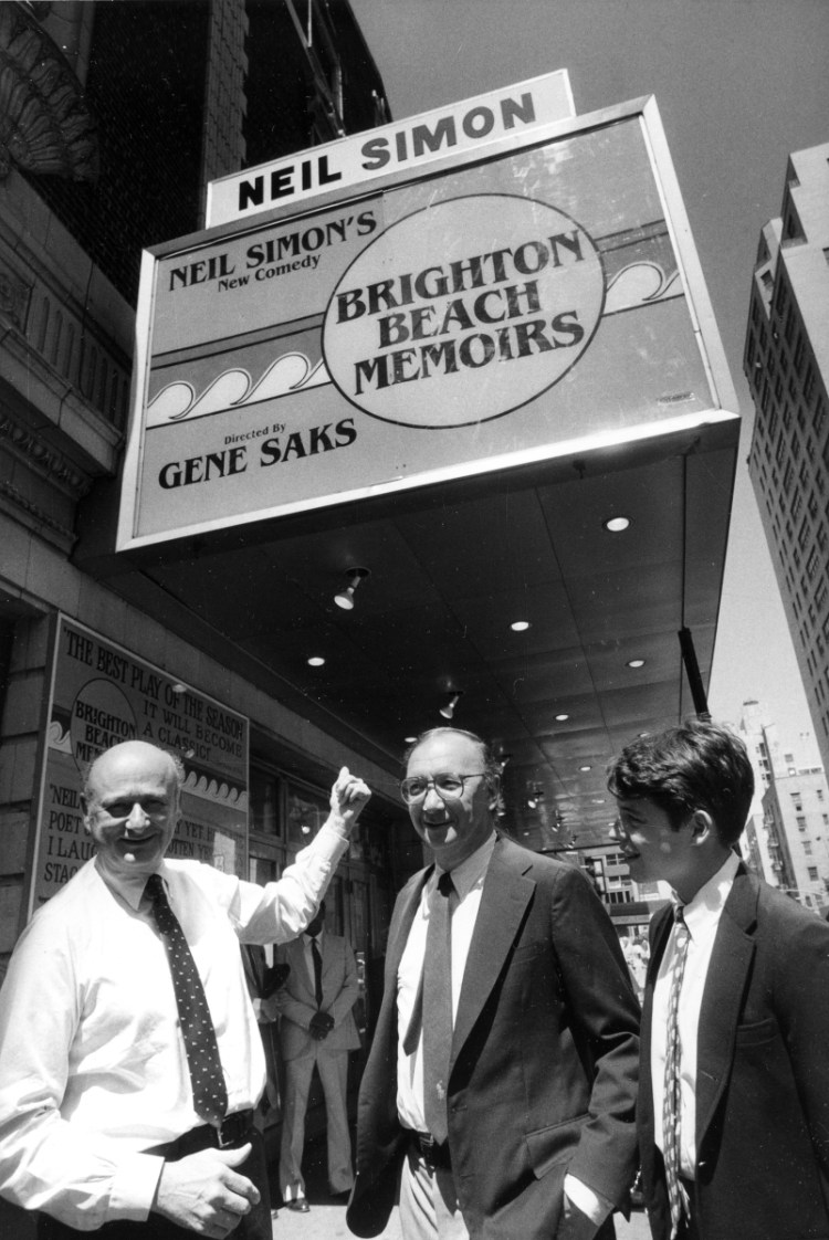 In this 1983 photo, Mayor Ed Koch, left, points to the new marquee which renames the Alvin Theater the Neil Simon Theatre as he is joined by playwright Neil Simon, center, and actor Matthew Broderick in New York. 