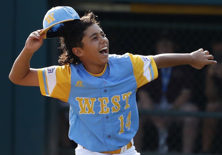 Honolulu, Hawaii pitcher Ka'olu Holt begins to celebrate after pitching a complete game, 3-0 shutout in the Little League World Series championship game Sunday against South Korea in South Williamsport, Pa.