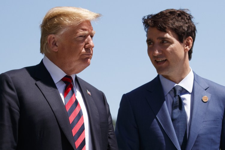 President Trump and Canadian Prime Minister Justin Trudeau converse during a G-7 Summit welcome ceremony this past June in Charlevoix, Quebec.