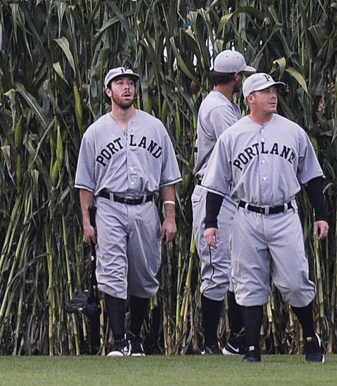 Portland Sea Dogs enter Hadlock Field through cornstalks while wearing throwback uniforms as part of their annual Field of Dreams game Wednesday. It was the next-to-last home game of the season for the Sea Dogs, who won 10-9.