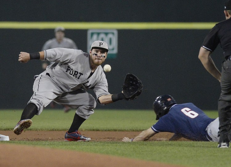 PORTLAND, ME - AUGUST 29: Portland's Esteban Quiroz waits for the throw as New Hampshire's Cavan Biggio dives into second base with a stolen base Wednesday, August 29, 2018. Quiroz was unable to hang on to the ball and Biggio was safe at second. (Staff photo by Shawn Patrick Ouellette/Staff Photographer)