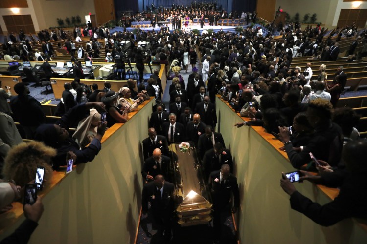 Pallbearers carry the casket out of Greater Grace Temple at the end of the funeral for Aretha Franklin on Friday in Detroit.