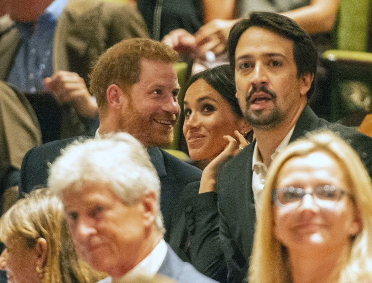 Prince Harry and his wife, Meghan, are seated next to Lin-Manuel Miranda at a gala performance of "Hamilton" in London on Wednesday. 