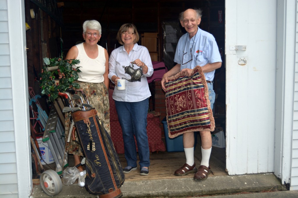 Farmington Historical Society treasurer Jane Woodman, left, with past-president Al McDaniel collecting items with donor Sylvia Yeaton at the Octagon House.