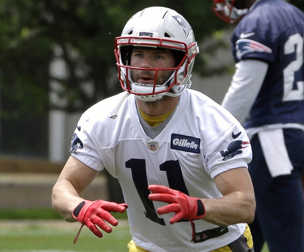 In this June 7 photo, New England Patriots wide receiver Julian Edelman waits for the ball during a minicamp practice, in Foxborough, Massachusetts. Edelman has made several rounds of apologies to the Patriots and fans following the four-game suspension handed down by the NFL for violating the league's policy on performance enhancers. Now he says he plans to use what's left of training camp to make sure his surgically-repaired knee will be ready to go when he is able to return to the field.
