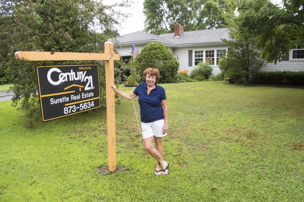Cathy Taylor shows her home which is up for sale on Merrill Street in Waterville on Saturday. Across Waterville, other residents are also tapping into what some say is the best housing market the city has seen in years.