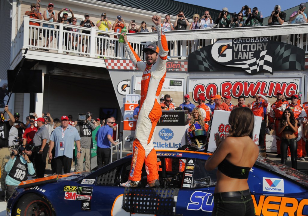 Chase Elliott, center, celebrates after winning a NASCAR Cup Series race Sunday in Watkins Glen, New York.