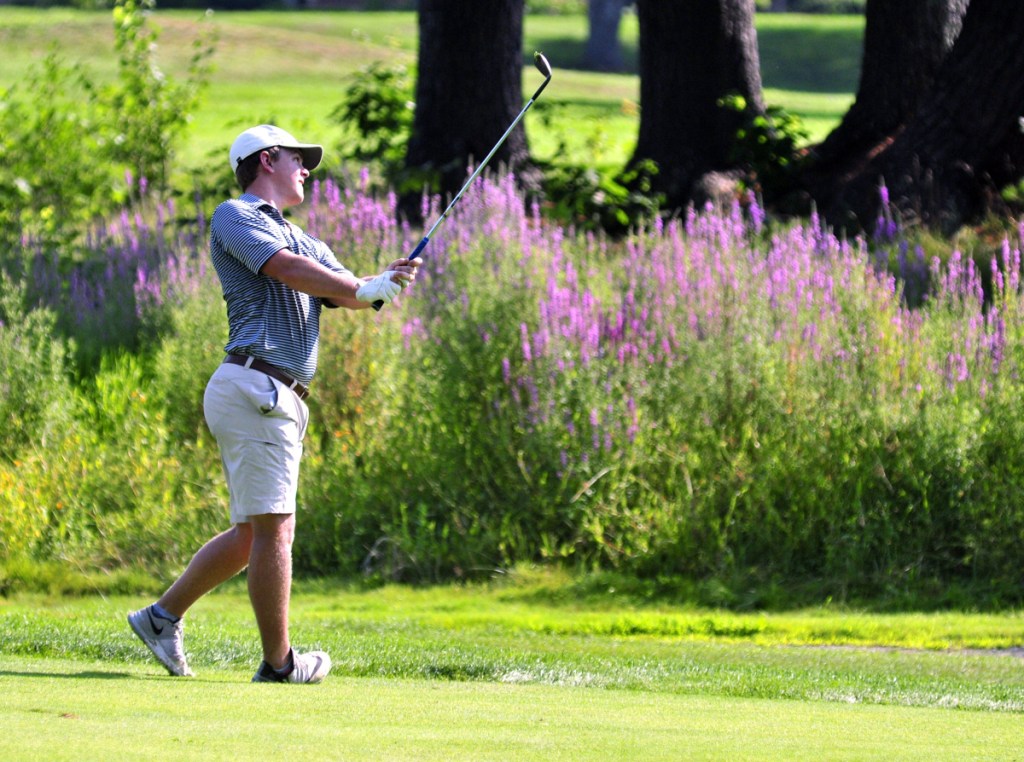 Staff photo by Joe Phelan 
 Jack Wyman hits a shot from the third fairway during the opening round of the Charlie's Maine Open on Tuesday at the Augusta Country Club in Manchester.