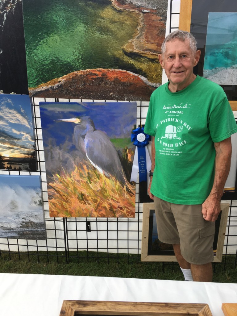 Walter Mularz with his award-winning photograph in the 2-D fine art category.