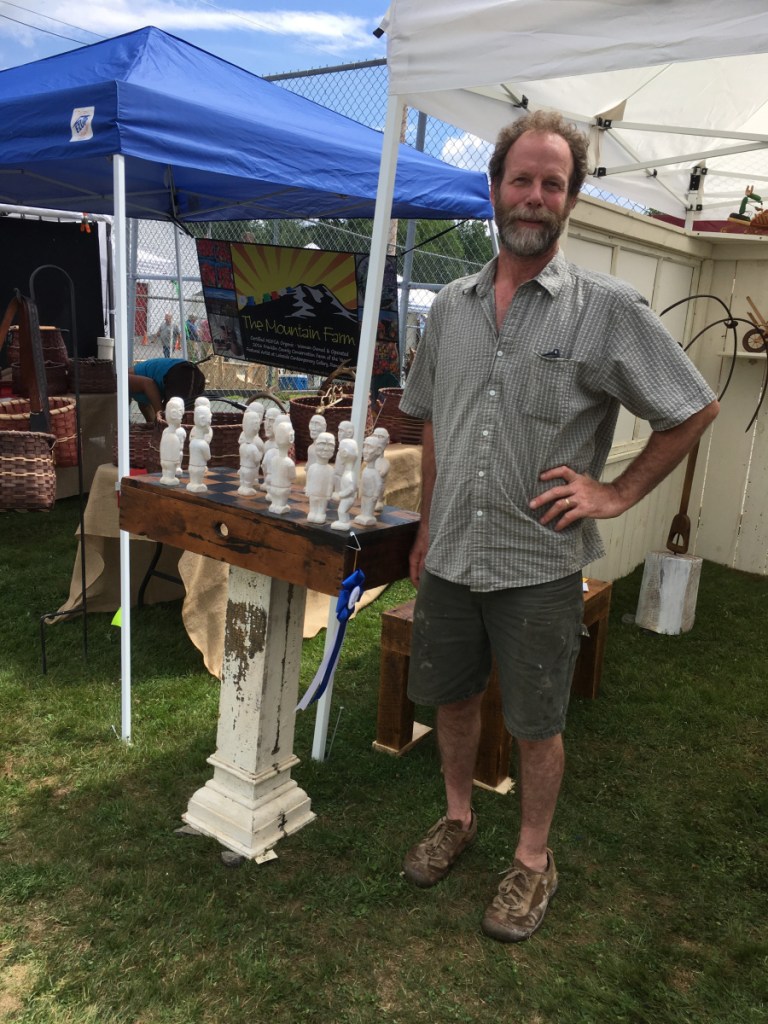Rick Osterhout with his award-winning sculpture in the 3-D fine craft category.