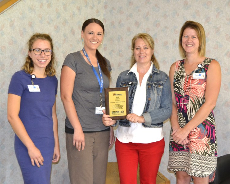 Evergreen Behavioral Services, based in Farmington, was recognized for meeting the gold award level for efforts to implement policies, procedures and treatment strategies to prohibit smoke and tobacco use on campus and address client tobacco use. From left are Ellen Thorne, HCC program and planning coordinator; Suzanna Brennan, EBS tobacco treatment specialist; Dalene Sinskie, EBS executive director; and Andrea Richards, HCC lead program and planning coordinator.