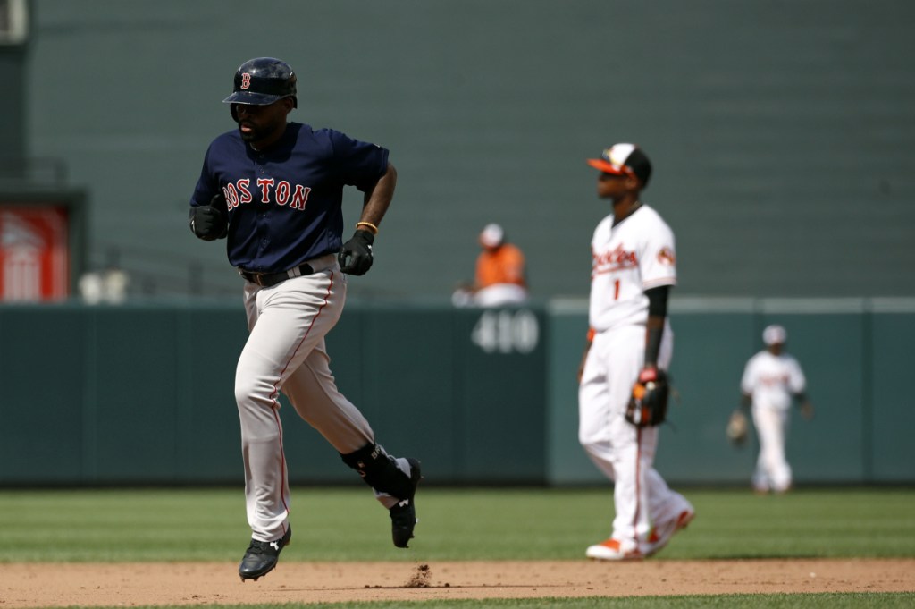 Boston Red Sox outfielder Jackie Bradley Jr., left, rounds the bases on a solo home run in the ninth inning of the first game of a doubleheader against the Baltimore Orioles on Saturday in Baltimore.