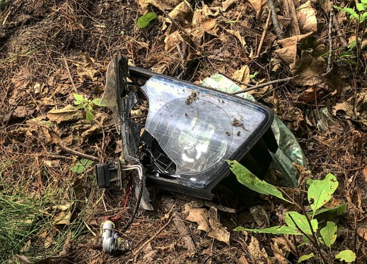 A broken headlight remains on the side of the road Sunday afternoon at the scene of a fatal crash early that morning on Augusta Road in Winslow. Gabriel Stuart, 52, of Waterville, was pronounced dead at the scene by medical personnel. Police have yet to determine the accident's cause.