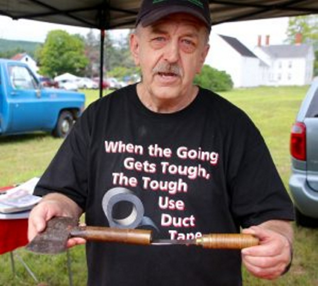 Howard Hardy displays an axe made and marketed by an Oakland company as "The President's Axe" after one was presented to Theodore Roosevelt when he traveled to Oakland in 1902. Hardy, of Oakland, was one of several vendors who attended an axe and saw meet in Waterboro on Saturday to talk about axes, and to sell or trade them.