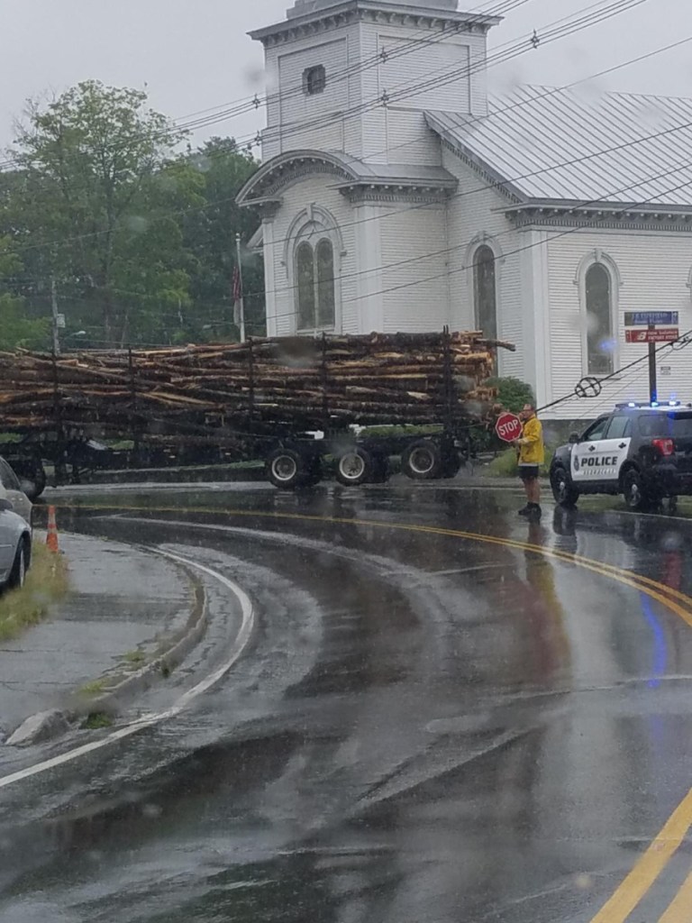 Two of the three lanes of traffic on Island Avenue in Skowhegan were closed Tuesday afternoon after a logging truck got caught in some wires.