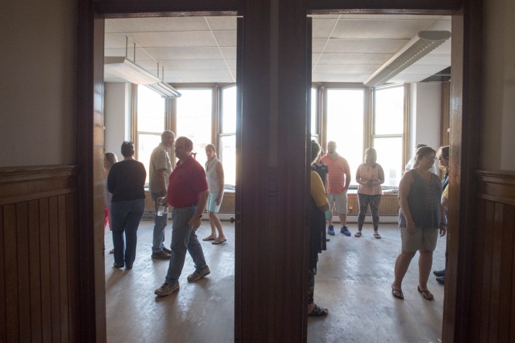 People tour the second floor of the new Cornville Charter School on Water Street in Skowhegan on Aug. 23, 2017.