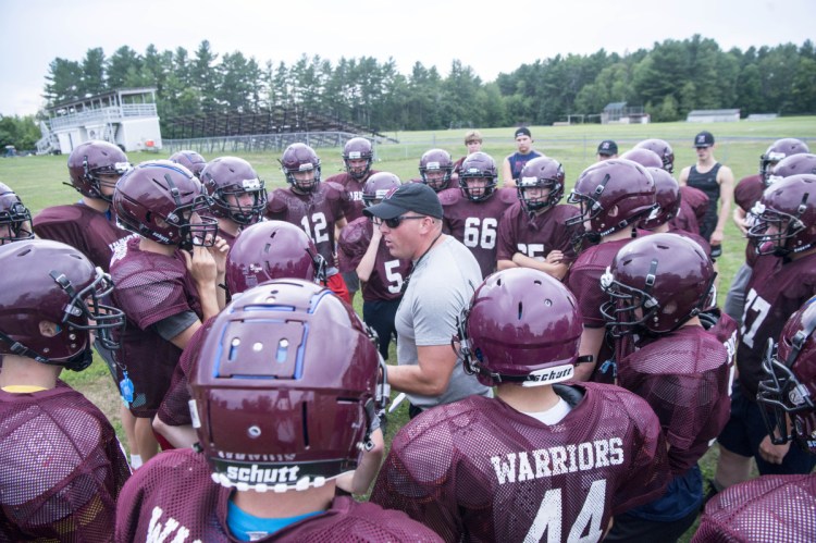 Staff photo by Michael G. Seamans 
 Nokomis football coach Jake Rogers talks to his team during practice Wednesday in Newport.