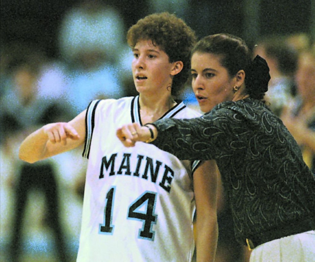 AP file photo 
 Maine coach Joanne Palombo goes over court strategy with Cindy Blodgett during a 1995 game against Delaware in Orono.