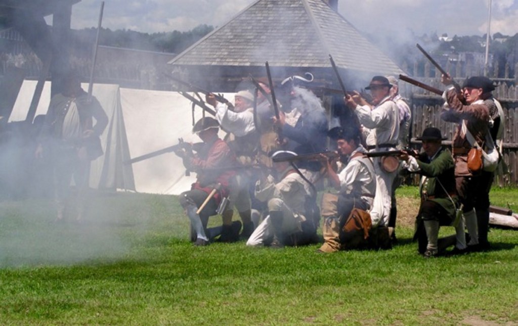 Musket volley by reenactors at Fort Western.