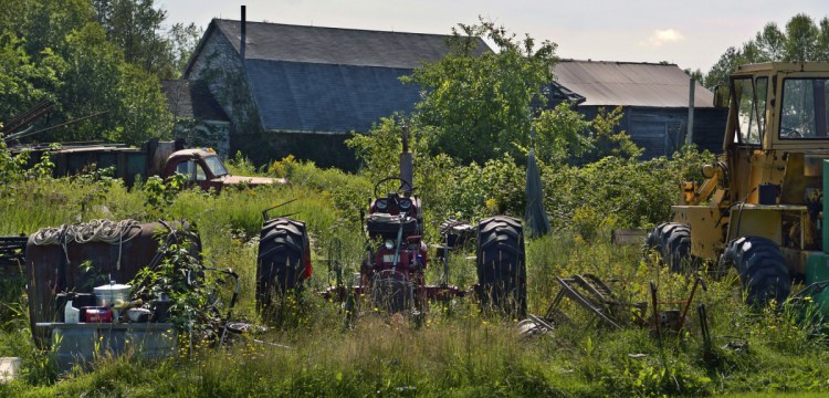 A variety of objects lie on the lawn Tuesday at a residence on Alexander Reed Road in Richmond. A court has ruled that the property is an illegal junkyard.