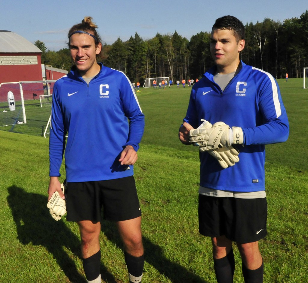 Colby College goalies Stanley Clarke, left, and Dan Carlson talk about the new athletics fields during a practice last September. Carlson, Clarke and the Mules will open the season Sept. 5 at Thomas College.