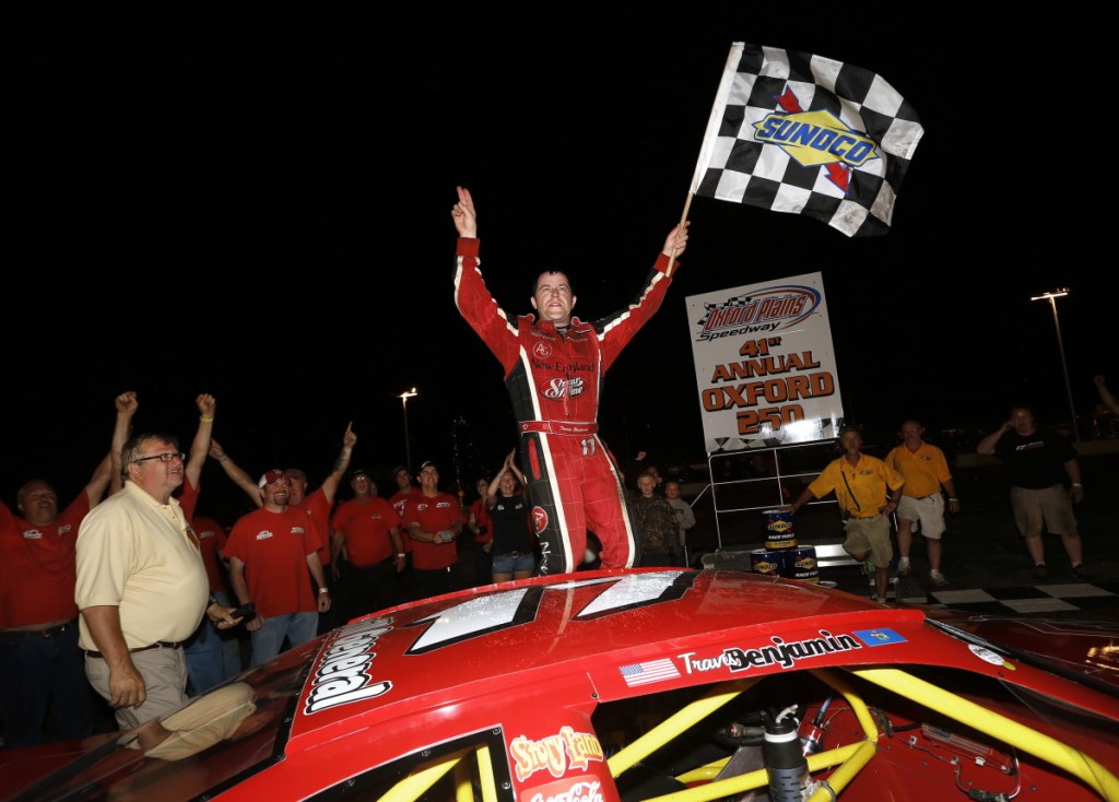 Travis Benjamin of Morrill celebrates after winning the Oxford 250 for the second consecutive year in 2014.