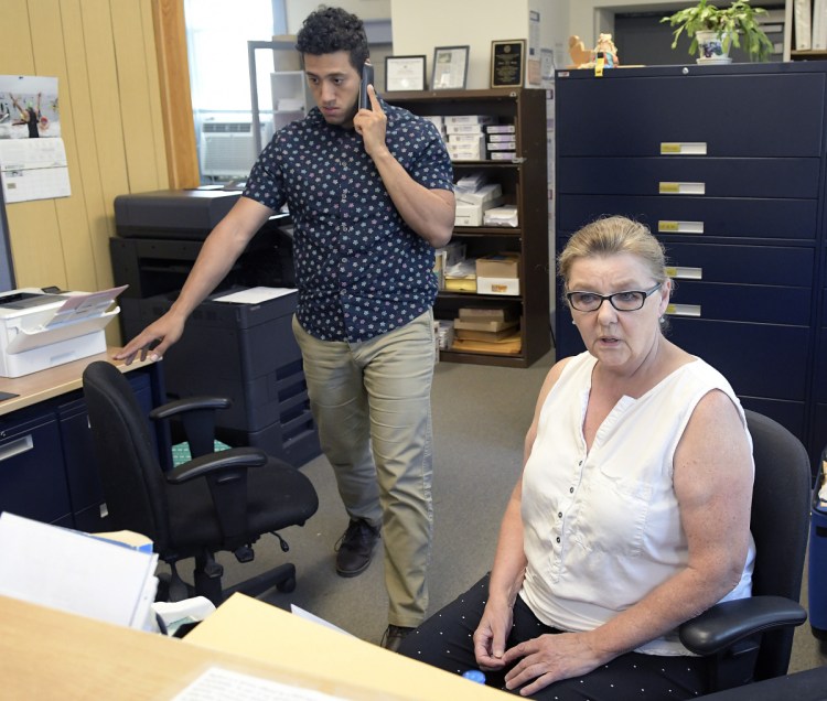 Dresden Clerk and Treasurer Shirley Storkson and administrative assistant Michael Henderson work Tuesday at the Dresden Town Hall.