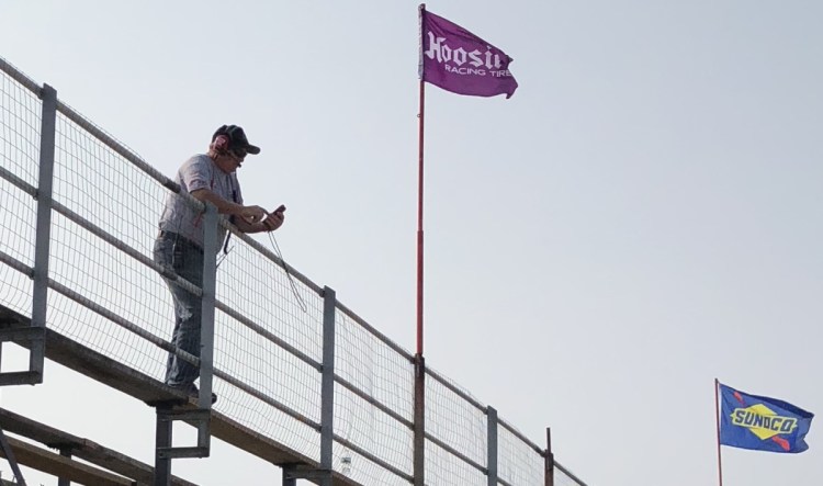 Steve Tapley of Deering, New Hampshire, keeps an eye on an Oxford 250 practice Friday afternoon at Oxford Plains Speedway in Oxford. Tapley has been Ben Rowe's spotter since the 2011 season.