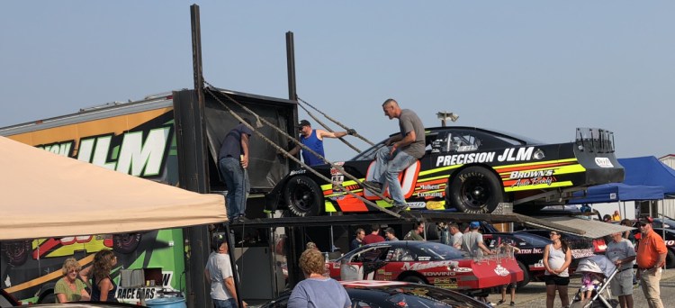 Crew members load the D.J. Shaw's No. 60 car following Oxford 250 practice Friday at Oxford Plains Speedway. Shaw, of Center Conway, New Hampshire, is the current Pro All Stars Series point leader.