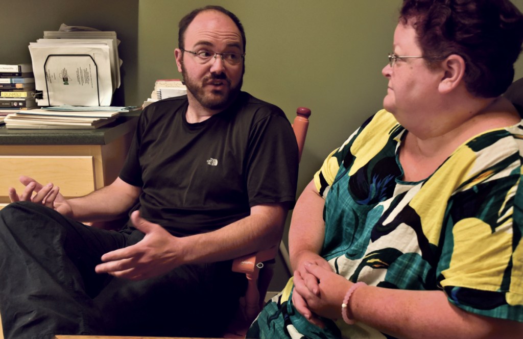 Mike Brown, former president of the board at the Humane Society Waterville Area, and current director Lisa Oakes discuss the financial condition of the Waterville facility on Wednesday. The shelter is launching a $250,000 capital campaign Monday to stave off possible closure in three months.